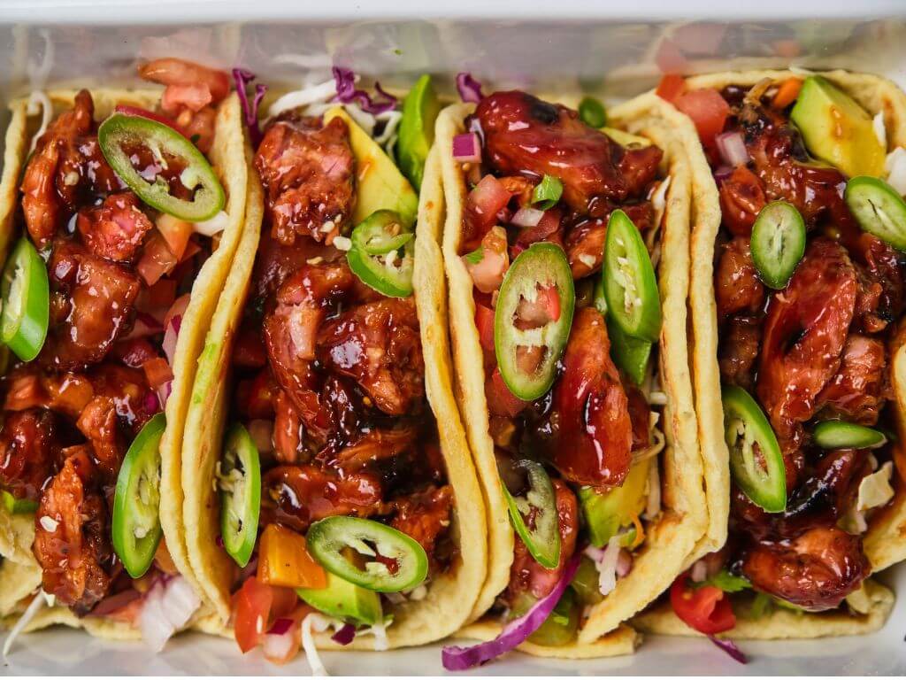 Detailed view of rib tacos with fresh ingredients and soft tortillas – shared meals inspiration.