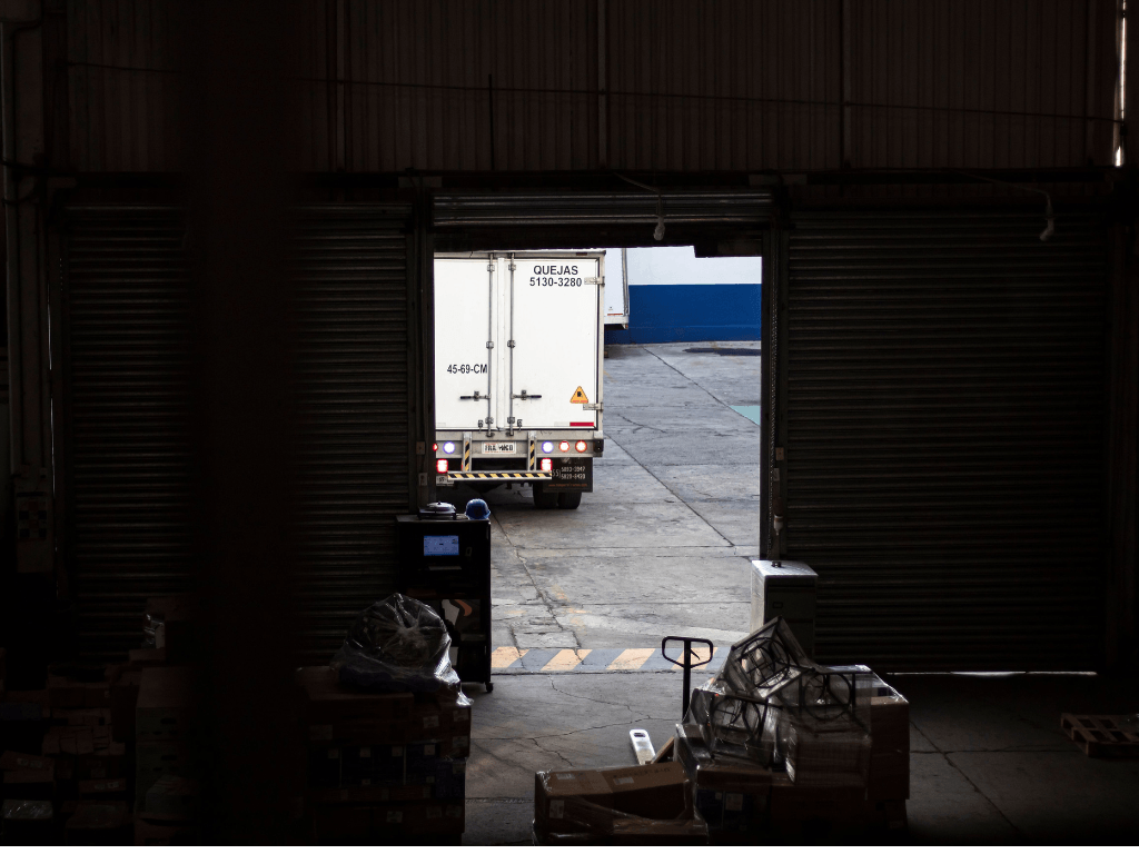 Refrigerated delivery truck at a distribution loading bay ensuring reliable supply chain logistics for commercial kitchens.